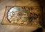 Antique-style leather desk mat styled on a tabletop.
