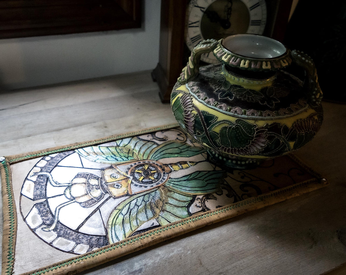 Antique vase displayed on a self for scale reference