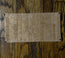 cork backing of the leather table protector pad shown from underneath.