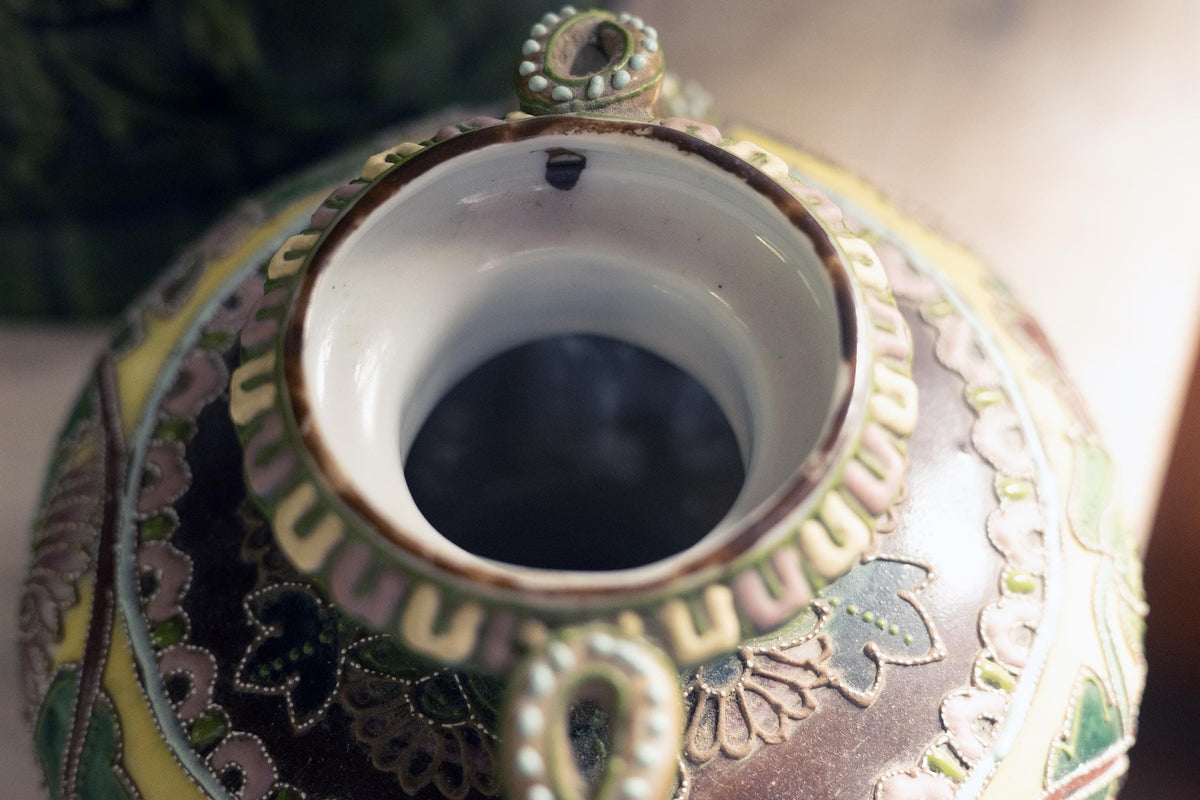 Close-up of the interior opening o reveal brown glaze spot before firing
