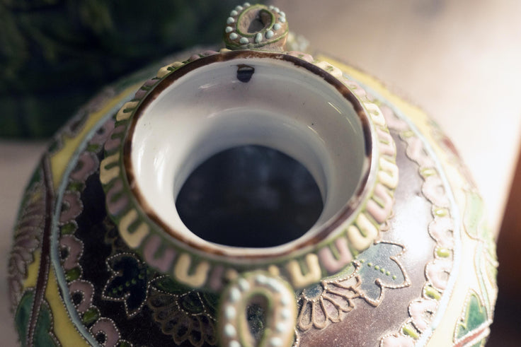 Close-up of the interior opening o reveal brown glaze spot before firing